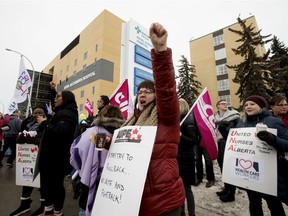 Members of the United Nurses of Alberta rally in support of publicly delivered health-care and front-line workers, outside the Royal Alexandra Hospital in Edmonton Thursday Feb. 13, 2020.