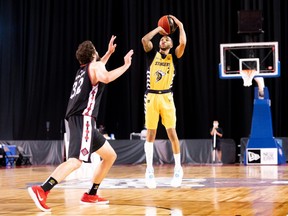 Edmonton Stingers guard Xavier Moon hits the game-winning shot in front of Kyle Landry of the Ottawa BlackJacks in an 88-75 victory at the Canadian Elite Basketball League Summer Series in St. Catharines, Ont., on Aug. 8, 2020.