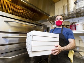 The Vegas Golden Knights hockey team donated dozens of pizzas to Boyle Street while they were in the Edmonton Bubble. Since then there fans have raised enough money to donate 591 pizzas. Robert Caruso, owner of Panini's Italian Cucina, is the one making the pizza. Taken on Thursday, Sept. 24, 2020 in Edmonton.  Greg Southam-Postmedia