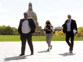 Calgary Mayor Naheed Nenshi (left) and Wood Buffalo Mayor Don Scott (right) walk past the dome of the Alberta Legislature following a meeting with Minister of Health Tyler Shandro about Alberta Health Services' plans to consolidate EMS Dispatch, in Edmonton Thursday Sept. 24, 2020. The meeting was also attended by the mayors of Red Deer and Lethbridge.