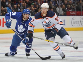 Connor McDavid (No. 97) of the Edmonton Oilers skates against John Tavares (No. 91) of the Toronto Maple Leafs during an NHL game at Scotiabank Arena on January 6, 2020 in Toronto.