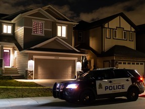 Edmonton Police Service officers investigate a suspicious death in a home at 17204 47 Street on Wednesday, Oct. 14, 2020. in Edmonton, on Wednesday, Oct. 14, 2020. Police entered the home at 10:30 am and continued to investigate into the night.
