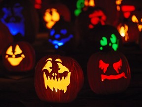 Jack-o'-lanterns are displayed at a 2014 exhibition in California. "Halloween will be different this year because of COVID-19, but it will still offer an opportunity for adults to help children confront an array of scary things. One of the scariest is racism," Cay Burton writes.