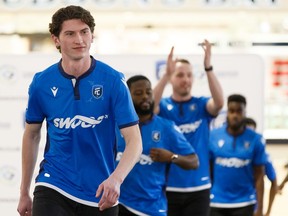 Attacker Easton Ongaro leads a group of players modeling FC Edmonton's new home jersey at West Edmonton Mall on Feb. 27, 2020. He has gone on loan to a team in Denmark.