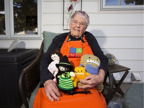 Lauretta Howard poses Oct. 3, 2020 with her knitted animals for GANG's online store.