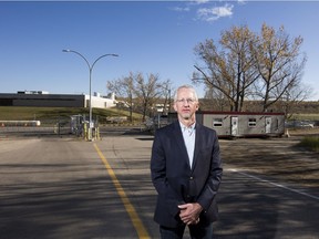 Stephen Madsen, president of the North Saskatchewan River Valley Conservation Societym stands in front of the E.L. Smith Water Treatment Plant Oct. 3, 2020, where Epcor's proposed solar would be located to the right of the plant. Madsen is in opposition to Epcor's proposed solar farm in the river valley tied to the E.L. Smith Water Treatment Plant. Council will be voting on the project Tuesday.