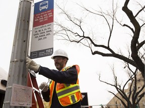 In preparation for Edmonton's changing bus routes on April 25, 2021, Mayor Don Iveson installs the first new bus stop sign in front of City Hall at one of the City's 7,000 bus stop locations on Tuesday, Oct. 13, 2020 in Edmonton.