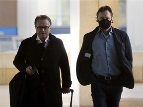 Shane Stevenson (right) walks to the courthouse with his lawyer Bob Hladun (left) on Wednesday, Oct. 14, 2020 in Edmonton.