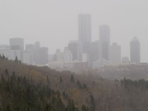 A light snowfall obscures the downtown skyline on Friday, Oct. 16, 2020 in Edmonton.