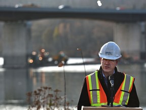 Jason Meliefste, acting deputy city manager of Integrated Infrastructure Services, speaks Thursday, Oct. 30, 2020, on the construction season coming to an end, in front of the Groat Road Bridge which all four lanes are slated to be open Monday.