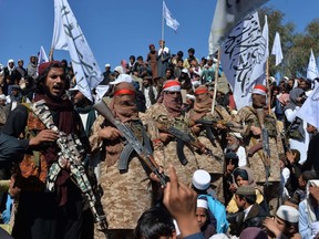 Afghan Taliban militants and villagers attend a gathering as they celebrate the peace deal and their victory in the Afghan conflict, in the Alingar district of Laghman Province, on March 2.