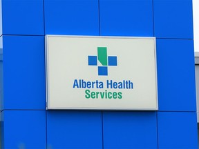 The Alberta Health Services logo is seen on the Southgate EMS Centre on Tuesday, October 13, 2020. The Alberta government is looking to cut about 11,000 Alberta Health Services jobs to save $600 million over three years.