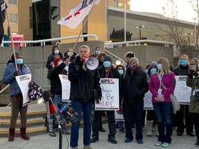 AUPE president Guy Smith speaks to AUPE health-care workers who walked off the job at the Royal Alexandra Hospital in Edmonton on Oct. 26, 2020.
