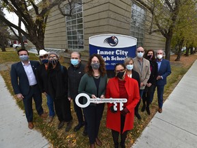 Officials pose for photos after the Edmonton Oilers Community Foundation (EOCF) gifted land and the school to the Inner City Youth Development Association at Inner City High School at an announcement in Edmonton, Friday, October 16, 2020.