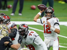 Tampa Bay Buccaneers quarterback Tom Brady (12) passes against the New Orleans Saints during the first quarter at the Mercedes-Benz Superdome.