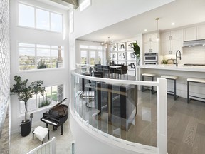 The dining area and open to below in the Sapphire show home by Jayman Built in Edgewater Estates.
