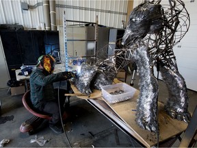 David McAuley works on the sculpture of a bear and a cub he is making out of forks, in his workshop near Calmar Alberta Thursday Oct. 1, 2020. McAuley has already used 6,000 forks (104 pounds of fork heads). He estimates that he needs another 10,000 forks to finish. The sculpture is approximately four feet tall by six feet wide. Photo by David Bloom