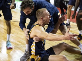 Jordan Baker is congratulated by his Edmonton Stingers teammates after scoring the winning basket of an 87-86 victory over the Niagara River Lions on Friday, July 31, to record the Canadian Elite Basketball League's first-ever come-from-behind win in an Elam Ending finish.