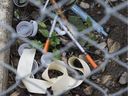 Discarded needles and drug paraphernalia in an alley near 101 Street and 105 Avenue in Edmonton on Sept. 2, 2020. 