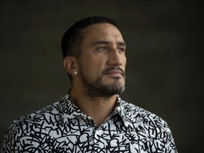 Jeff Chalifoux poses for a photo under the Walterdale Bridge, in Edmonton Saturday Sept. 5, 2020. In his teens Chalifoux spent time sleeping rough under the bridge. Chalifoux is a registered social worker currently working on his Masters in clinical social work.