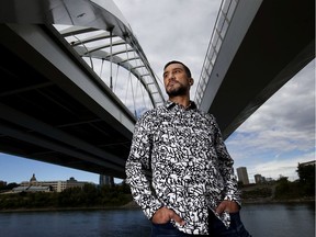 Jeff Chalifoux stands beneath the Walterdale Bridge, in Edmonton on Sept. 5, 2020. In his teens Chalifoux spent time sleeping rough under the bridge. Chalifoux is a registered social worker currently working on his Masters in clinical social work.