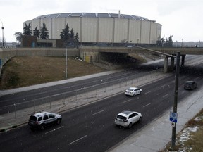 Traffic makes its way east along 118 Avenue past the vacant Northlands Coliseum, in Edmonton Friday Oct. 23, 2020.