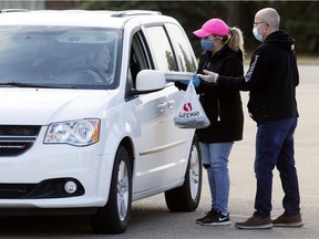 Volunteers hand out turkey dinner