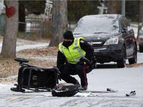 Police investigate at the scene where a child stroller was hit by a vehicle in the 122 Avenue and 87 Street intersection, in Edmonton Wednesday morning. A child was taken to hospital with unknown injuries. The mother who was pushing the stroller was not struck. Driver of the vehicle stayed on scene.