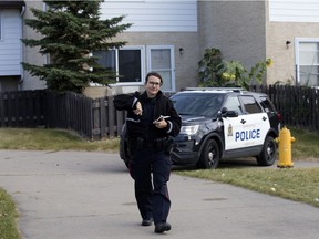 Police woman at townhouse complex.