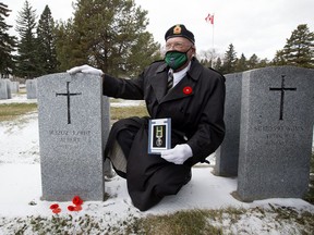 Brian Phelan poses for a photo following a ceremony were his father, WWII veteran Albert Phelan, was awarded the Canadian Efficiency Medal, in Edmonton October 21, 2020. The award was presented to Brian Phelan at his father's grave in Beechmount Cemetary, 12420 104 St.
