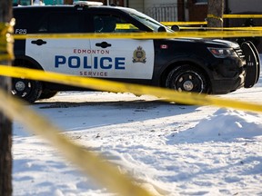 Edmonton Police Service officers investigate a reported shooting at a home at 12046 102 Street in Edmonton, on Wednesday, Nov. 11, 2020.