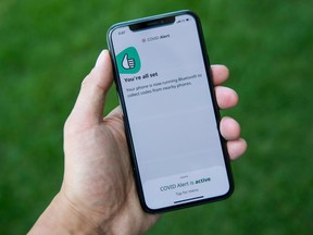 The COVID Alert app is seen on an iPhone in Ottawa on July 31, 2020. As COVID cases rise in Alberta, the province has still not adopted the federal system.