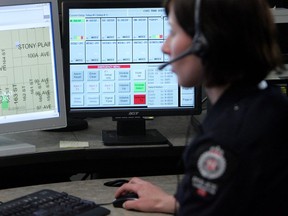A 911 dispatch operator  at Edmonton police headquarters.
