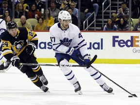 Toronto Maple Leafs left wing Pierre Engvall (47) skates with the puck against pressure from Pittsburgh Penguins center Dominik Kahun (24) during the third period at PPG PAINTS Arena on Feb. 18, 2020.