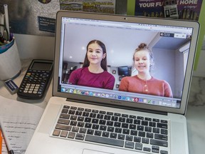 Two students on a labtop