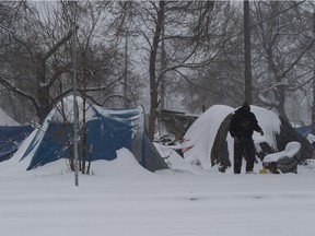 Snow covers tents in camp Pekiwewin on Saturday, Nov. 7, 2020 in Edmonton.
