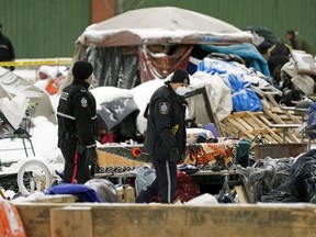 Police and peace officers closed the homeless camp near downtown Edmonton known as Camp Pekiwewin on Thursday, Nov. 12, 2020.