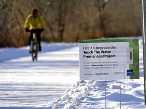 A man cycles along River Valley Road on Nov. 12, 2020, the site of the potential Touch The Water promenade project from Rossdale power plant to Government House Park.