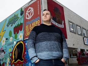 iHuman interim executive director Matthew 'Gus' Gusal stands outside iHuman, 9635 102A Ave., in Edmonton Monday Nov. 30, 2020. iHuman Youth Society is recruiting "guerrilla fundraisers" to mobilize the community to donate funds to help young people in need receive personalized Christmas gifts from local businesses.