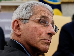 Dr. Anthony Fauci attends a coronavirus response meeting between U.S. President Donald Trump and Louisiana Governor John Bel Edwards in the Oval Office in Washington, U.S., April 29, 2020.