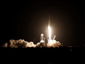 A SpaceX Falcon 9 rocket, with the Crew Dragon capsule, is launched carrying four astronauts on the first operational NASA commercial crew mission at Kennedy Space Center in Cape Canaveral, Fla., Sunday, Nov. 15, 2020.