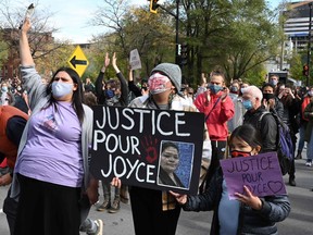 Protesters gather during a demonstration in central Montreal on October 3, 2020, to demand action for the death of Joyce Echaquan, a Canadian indigenous woman subjected to live-streamed racist slurs by hospital staff before her death.