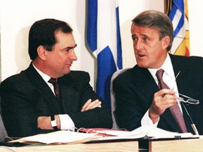 Then-prime minister Brian Mulroney confers with deputy prime minister Don Mazankowski (left) prior to a cabinet meeting in Montreal in 1986.