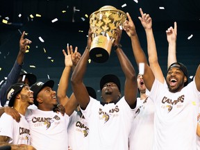 Edmonton Stingers head coach Jermaine Small lifts the Canadian Elite Basketball League championship trophy after a 90-73 win against the Fraser Valley Bandits in the CEBL Summer Series final at the Meridian Centre in St. Catharines, Ont., on Aug. 9, 2020.