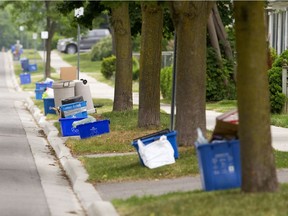Blue boxes will no longer be picked up by City of Edmonton recycling collectors starting Monday. Residents will need to put materials in blue bags for collection.