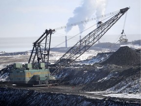 A giant drag line works in the Highvale Coal Mine to feed the nearby Sundance Power Plant near Wabamun on March 21, 2014.