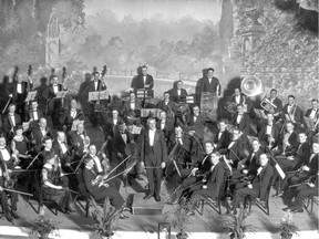 Group photo of the Edmonton Symphony Orchestra (1923), taken at the Empire Theatre (10159-103 St). Henri Baron, Conductor. (Glenbow archives)
