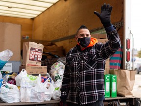 Dan Johnstone, aka Can Man Dan, is in the middle of his third four-day campout this Christmas season to raise money and donations for Edmonton's Food Bank, seen outside collecting donations at Safeway at 2304 109 Street in Edmonton, on Saturday, Dec. 5, 2020. Photo by Ian Kucerak