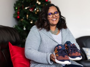 Hala Hussein poses for a portrait in Edmonton, on Wednesday, Dec. 16, 2020. Hussein is in a Workshop West project called The Shoe Project, which is storytelling by new Canadians who are invited to see their immigrant or refugee experience through the lens of a shoe. Photo by Ian Kucerak