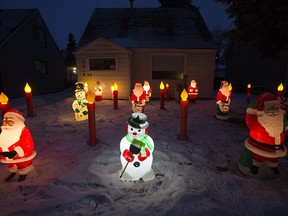A series of vintage Christmas decorations populate a font yard near 92 Street 90 Avenue, in Edmonton Wednesday Dec. 23, 2020. Photo by David Bloom